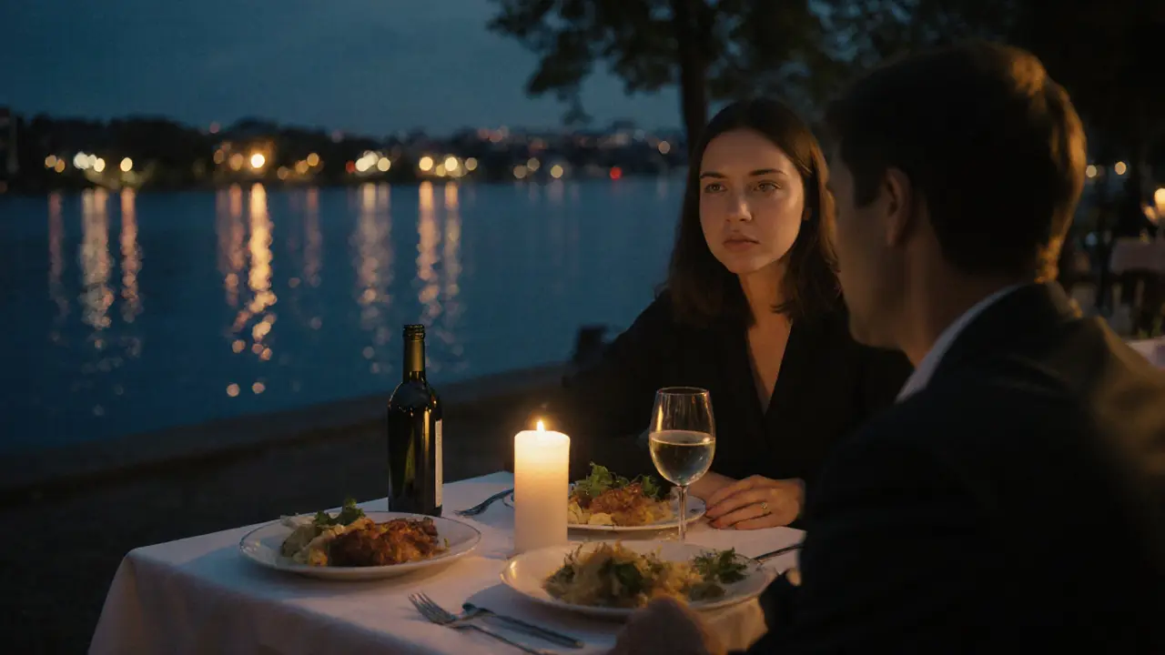 Candlelit dinner by a lake with soft reflections and twilight ambiance.