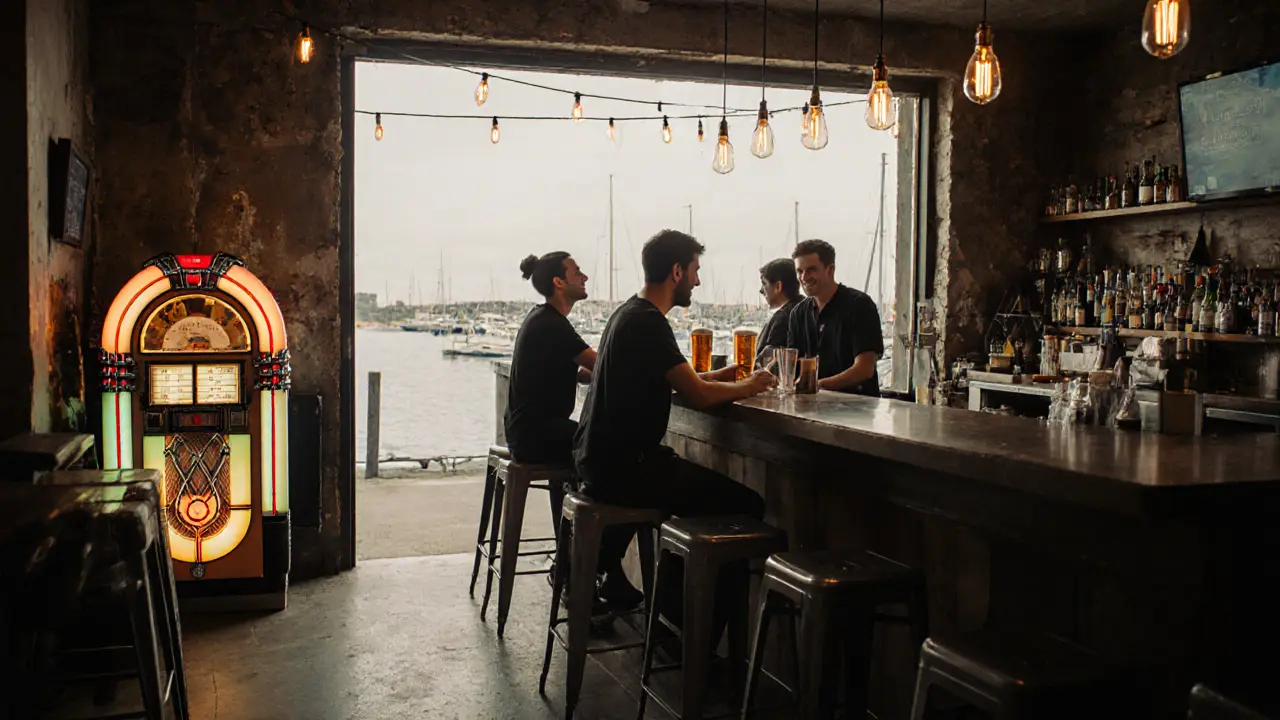 Rustic waterfront bar with jukebox and bartender serving beer to sailors and artists at night.