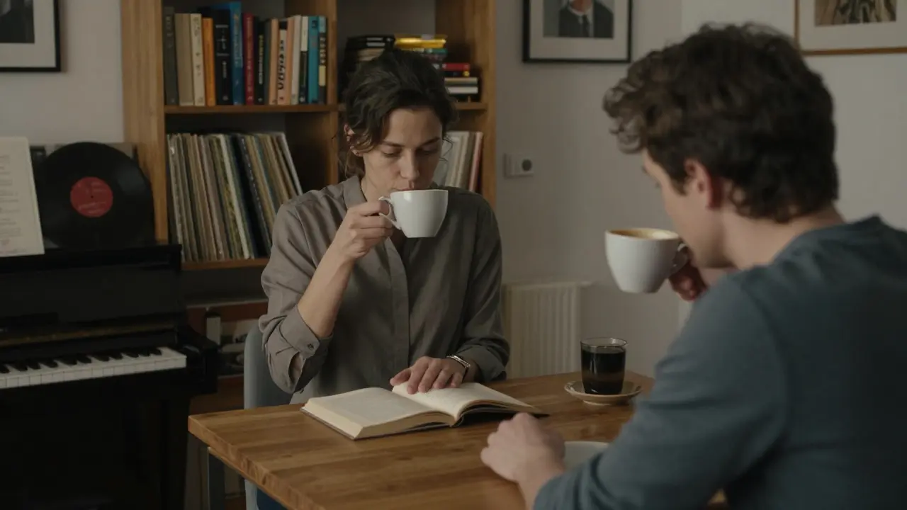 Two people share coffee and conversation in a warm, book-filled Berlin apartment, a piano softly visible in the background.